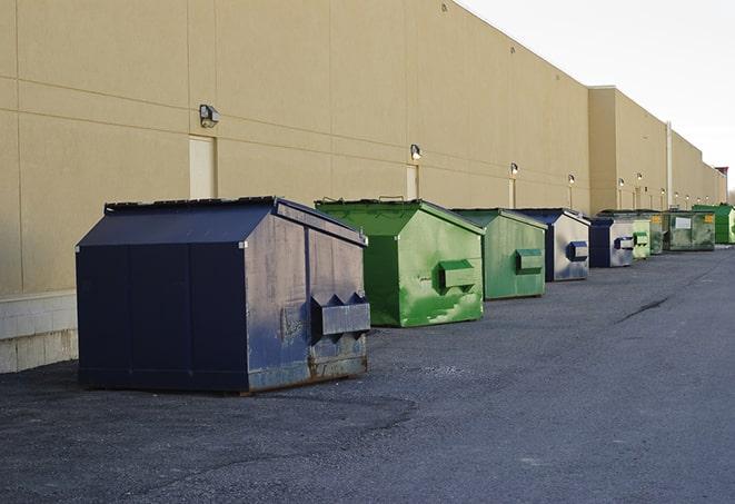 a row of heavy-duty dumpsters ready for use at a construction project in Allen Park